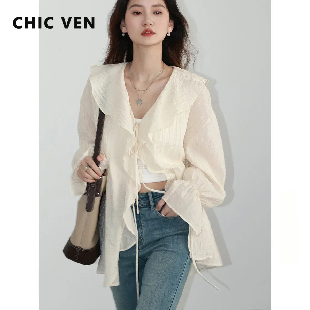 Chic Ruffled V-Neck Lace-Up Blouse, perfect for spring and summer, combines elegance and comfort. With a beautiful ruffled neckline and playful lace-up detailing, this loose-fit blouse offers breathability and style. Available in versatile colors,