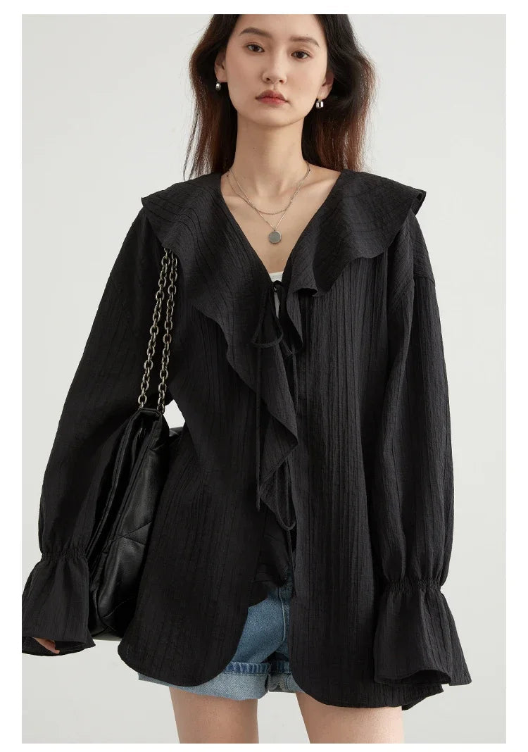 Chic Ruffled V-Neck Lace-Up Blouse in versatile colors, designed for the modern woman. Featuring an elegant ruffled neckline, playful lace-up detailing, and a loose fit for ultimate comfort. Perfect for transitioning from day to night, this