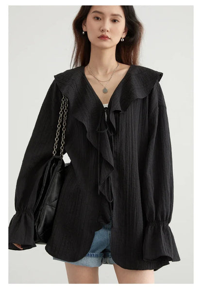 Chic Ruffled V-Neck Lace-Up Blouse in versatile colors, designed for the modern woman. Featuring an elegant ruffled neckline, playful lace-up detailing, and a loose fit for ultimate comfort. Perfect for transitioning from day to night, this