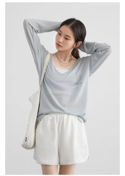 Elevate your wardrobe with our Loose V-Neck Embroidered T-Shirt, perfect for Spring/Summer 2024. This stylish tee features a lightweight, breathable fabric that ensures comfort while providing natural sun protection. The elegant embroidery adds a chic touch