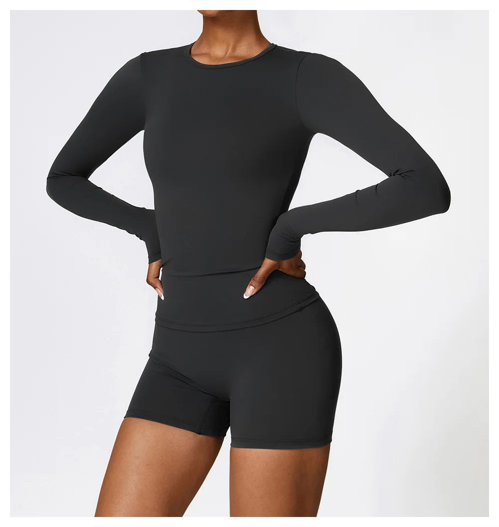 Elevate your activewear collection with the NCLAGEN Yoga Shirt! This sleek long-sleeve top features a quick-dry, breathable nylon and spandex blend for ultimate comfort during workouts. With a flattering slim fit that enhances your silhouette and full