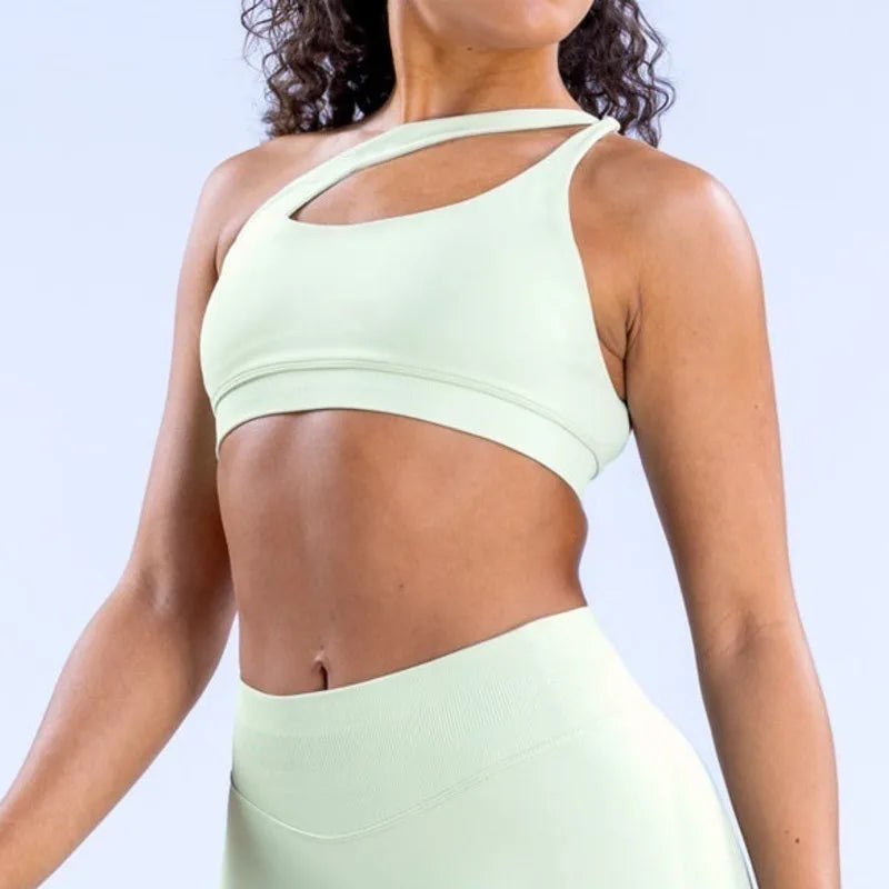 Elevate your activewear collection with the NCLAGEN Impact Asymmetric Sports Bra. This stylish halter design combines high support with a trendy backless look, perfect for yoga, workouts, or casual wear. Made from quick-dry, breathable nylon
