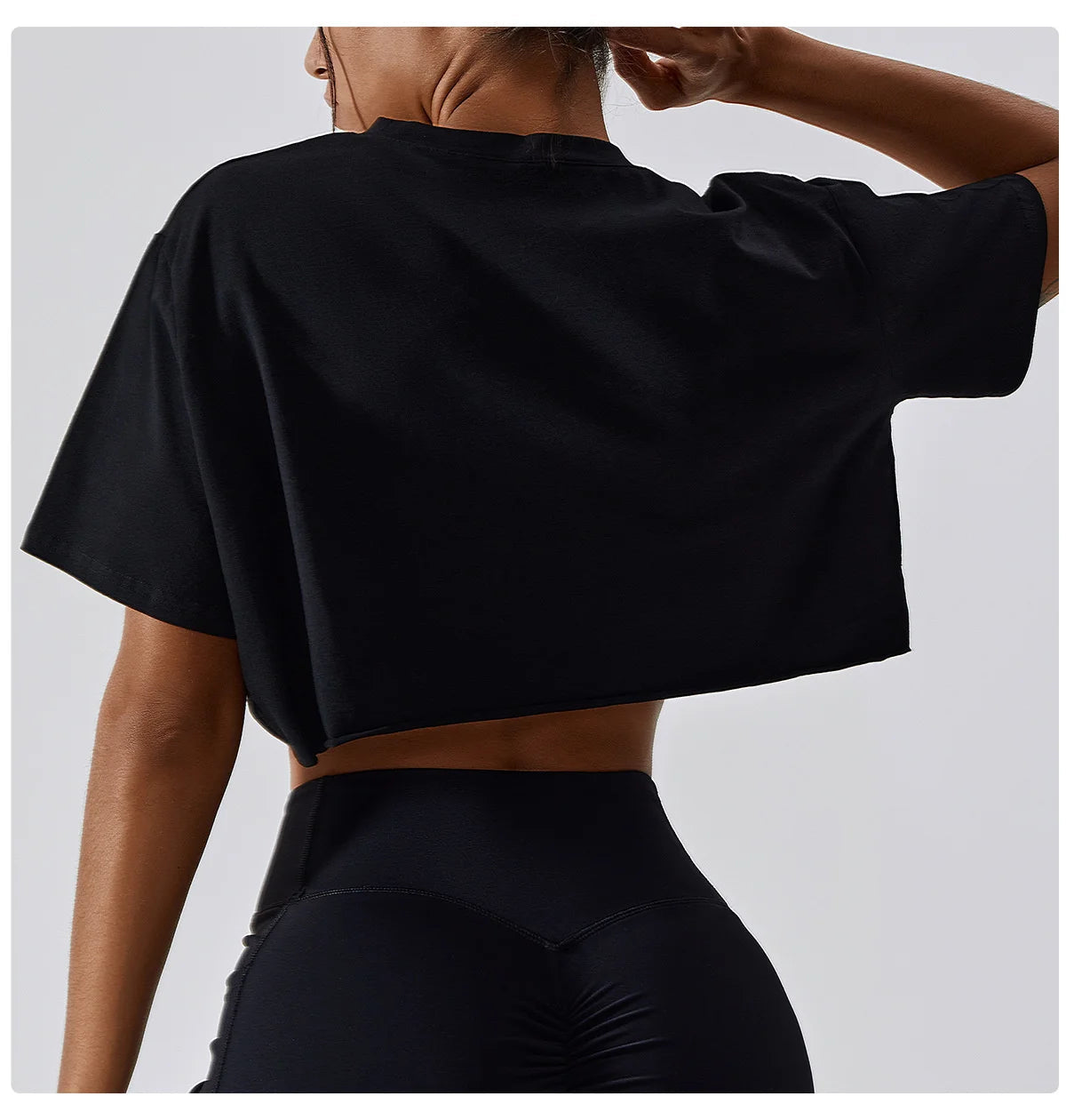 Stylish black crop top designed for ultimate comfort and functionality. Made from soft, breathable cotton and spandex, this loose-fitting T-shirt is perfect for yoga, dance, or running. Enjoy unrestricted movement and quick-dry technology while looking chic during your