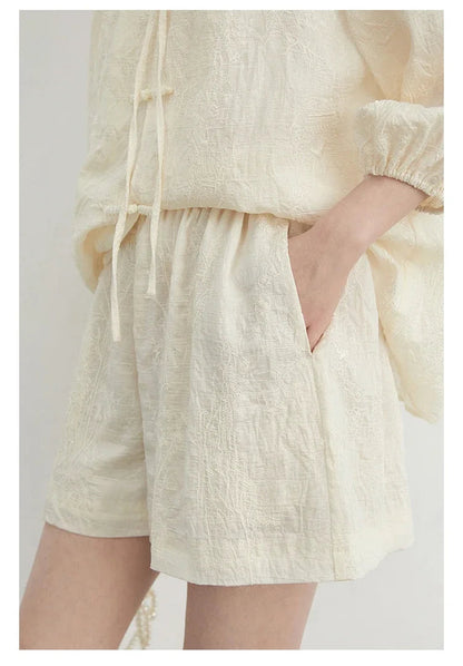Discover the exquisite **Embroidered Chinese Blouse & Shorts Set**, a perfect blend of traditional artistry and modern elegance. Crafted from soft, breathable fabric, this outfit ensures comfort on warm days while its relaxed fit flatters every silhouette. The intricate embroidery