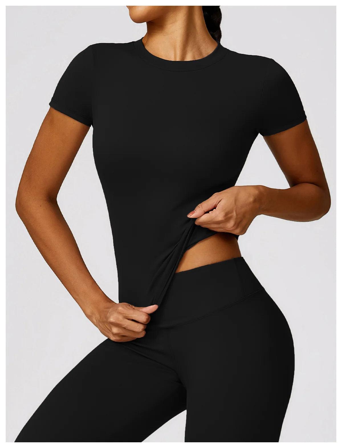 Elevate your fitness wardrobe with the NCLAGEN Short Sleeve T-Shirt! This stylish black tee features lightweight, breathable nylon, ensuring maximum comfort during workouts, yoga, or casual outings. With a fitted silhouette and round neck design, it flatters your