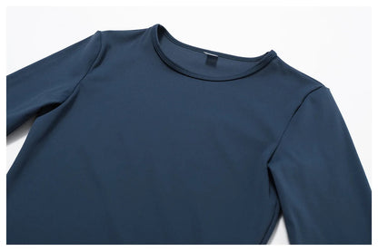 Elevate your activewear collection with the NCLAGEN Yoga Shirt! This stylish long-sleeve top combines high elasticity and breathable fabric, ensuring comfort during any workout. Crafted from a quick-dry nylon and spandex blend, it offers a flattering