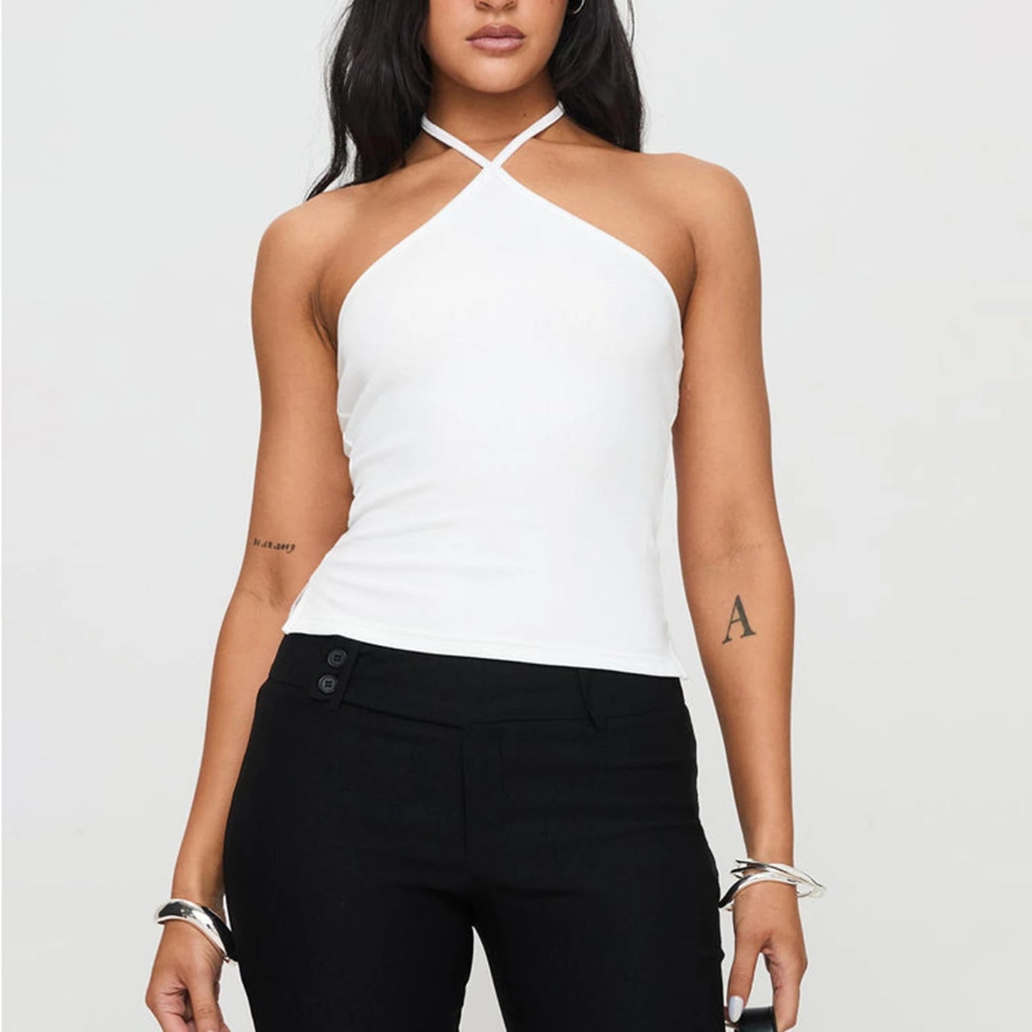 Chic solid hanging neck camisole designed for summer style, featuring a backless, slim-fit silhouette. Made from a soft cotton-spandex blend, this lightweight tank top offers all-day comfort and breathability. Perfect for streetwear or Y2K