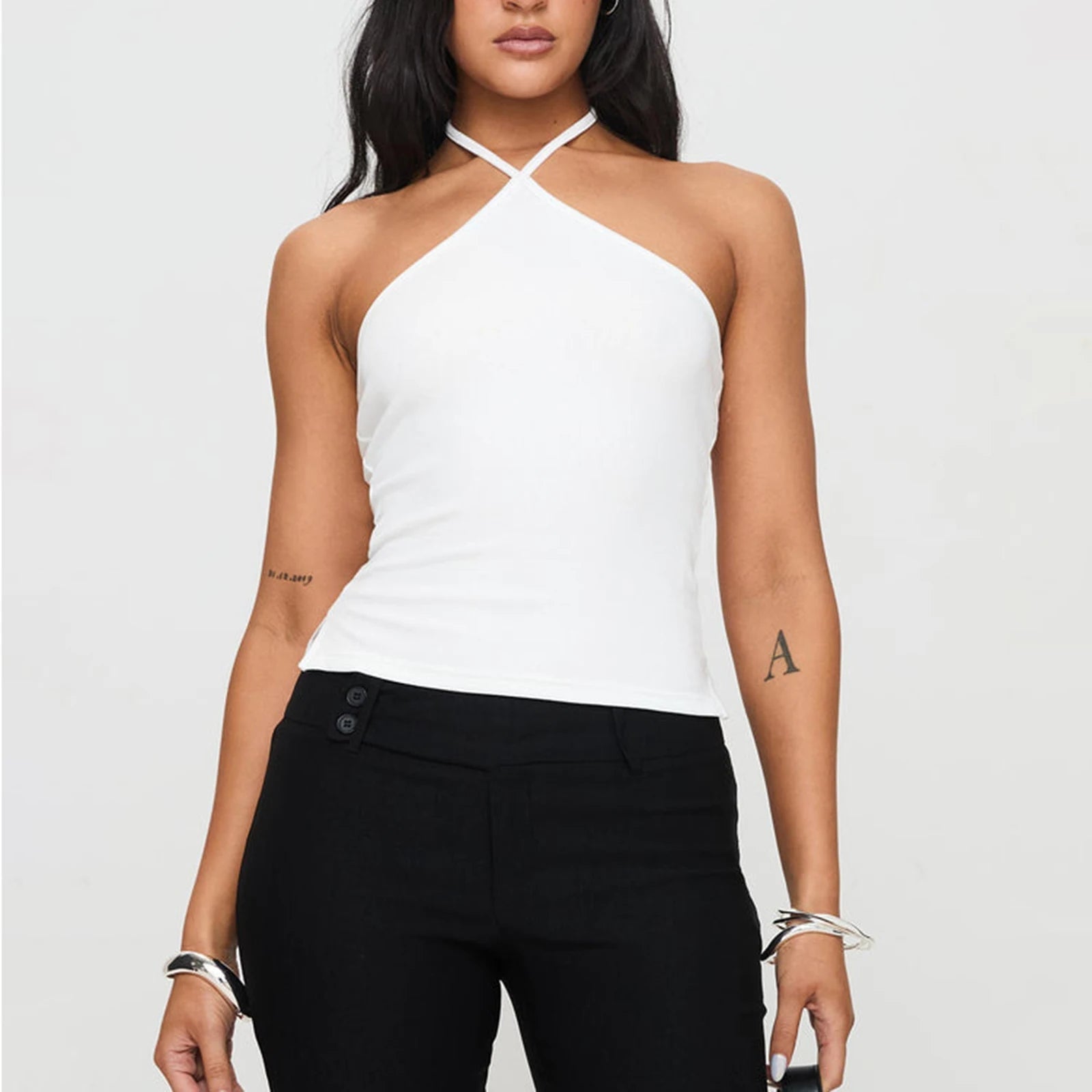 Chic solid hanging neck camisole designed for summer style, featuring a backless, slim-fit silhouette. Made from a soft cotton-spandex blend, this lightweight tank top offers all-day comfort and breathability. Perfect for streetwear or Y2K