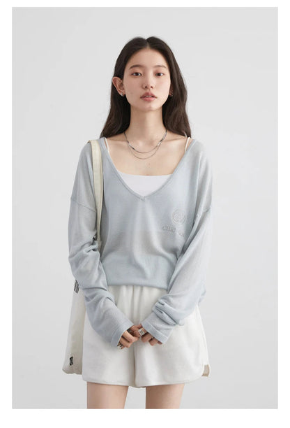 Discover our **Loose V-Neck Embroidered T-Shirt**, a perfect blend of style and comfort for Spring/Summer 2024. Made from lightweight, breathable fabric, this tee offers natural sun protection while keeping you cool. The elegant embroidered details