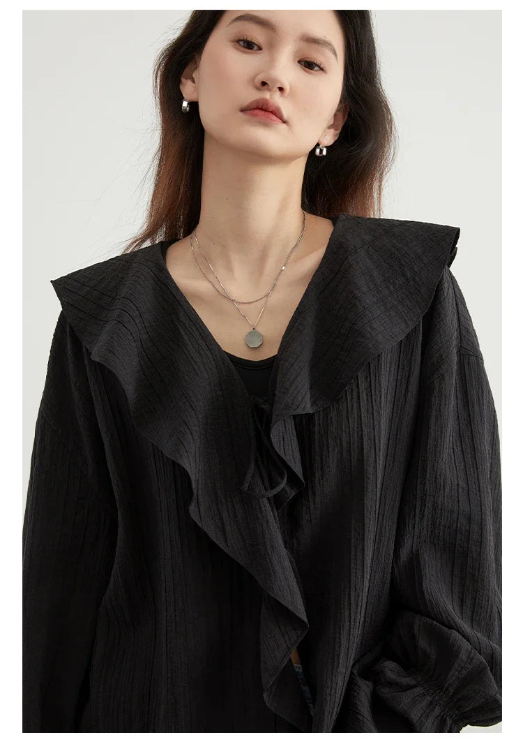 Effortlessly chic Ruffled V-Neck Lace-Up Blouse designed for the modern woman. This stylish blouse features a beautiful ruffled neckline and playful lace-up detailing for an adjustable fit. With a loose fit for breathability and comfort, it’s