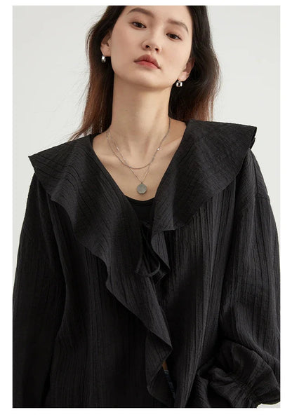 Effortlessly chic Ruffled V-Neck Lace-Up Blouse designed for the modern woman. This stylish blouse features a beautiful ruffled neckline and playful lace-up detailing for an adjustable fit. With a loose fit for breathability and comfort, it’s