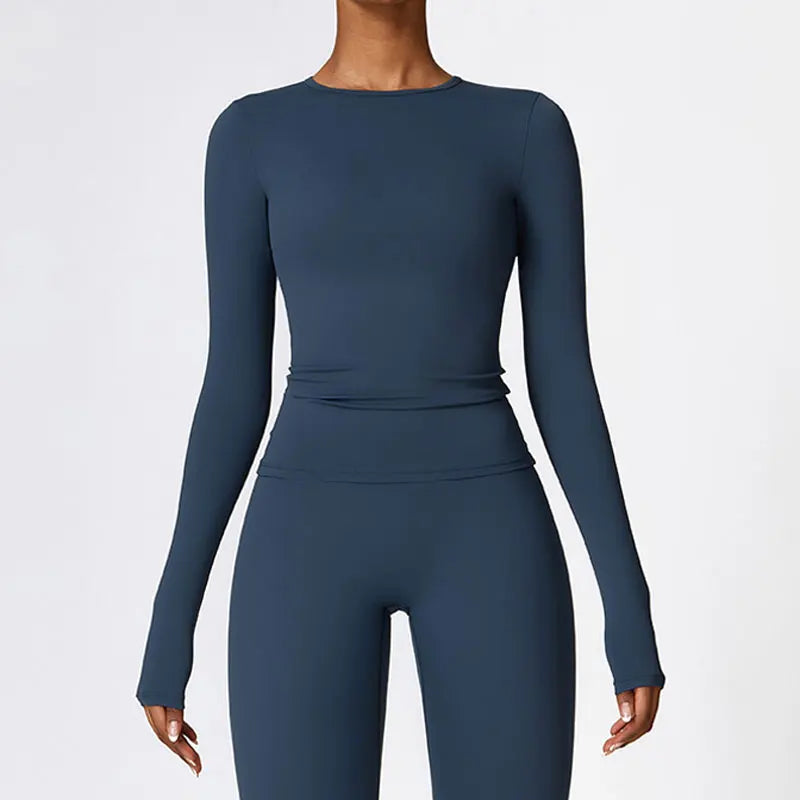 Elevate your activewear collection with the NCLAGEN Yoga Shirt! This stylish long-sleeve top features a quick-dry, breathable nylon and spandex blend, ensuring maximum comfort during workouts. The flattering slim fit enhances your silhouette, making it