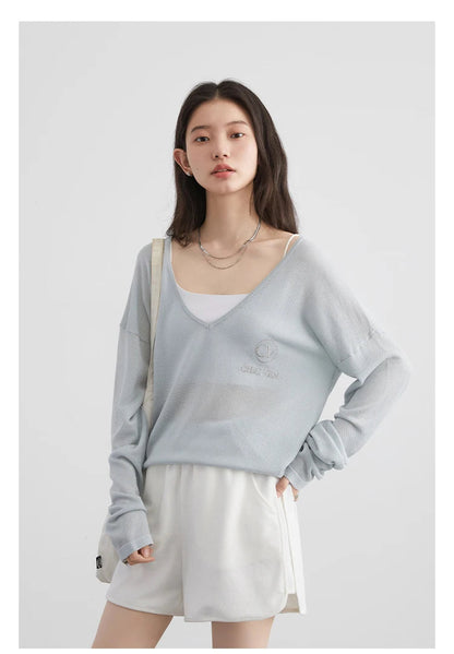 Discover our **Loose V-Neck Embroidered T-Shirt**, a perfect blend of comfort and style for Spring/Summer 2024. This lightweight tee features breathable fabric that keeps you cool while providing natural sun protection. The elegant embroidered details add a