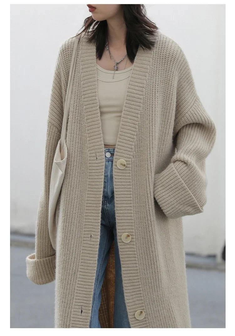 Discover the ultimate blend of comfort and style with our Korean Loose Knitted Cardigan & Long Coat. Crafted from luxuriously soft knitted fabric, this oversized piece offers a cozy fit that flatters every figure. Featuring a timeless button closure, it's perfect